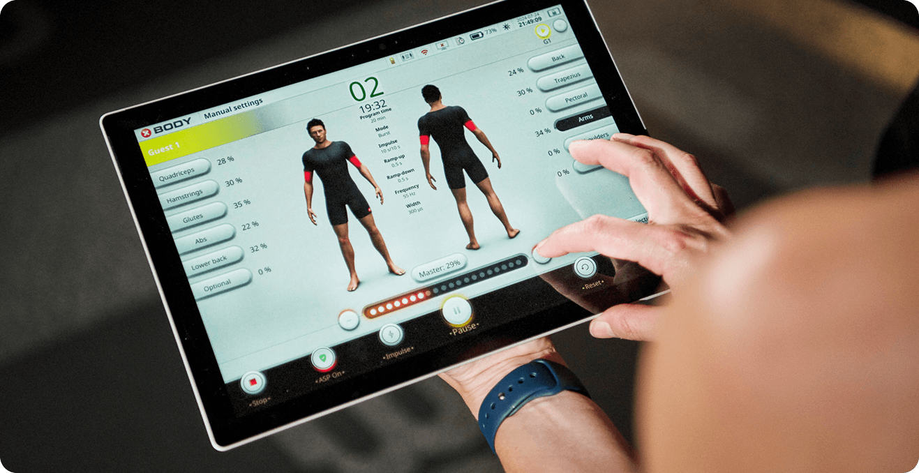 A Coach setting suit intensity on a tablet